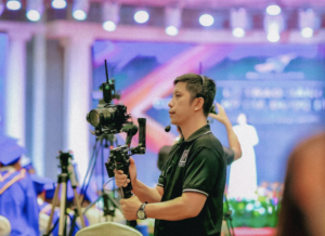 Cameraman with a large camera recording a scene